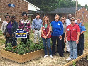 The team that helped build and plant the new Lowe’s Community Gardens at the Wilson Housing Authority’s EB Jordan Homes poses in front of the garden’s tomato bed. From Left to Right are housing authority residents Karla Evans, Salanda Blount and her son Henry, Housing Authority Resident Services Director Cathy Kent, Housing Authority Development Director Troy Davis, Lowe’s Assistant Store Manager Casey Smith, Master Gardener Julia Newton, Lowe’s Store Manager Vanessa Drew, Senior Wilson Police Officer Kolly Burritt, EB Jordan Homes Specialist Timothy Bastien and Senior Wilson Police Officer Angie Harold.