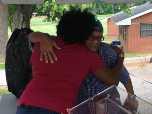 The Wilson Housing Authority’s Senior Day event is all about saying thank you to the authority’s senior residents – and playing a few games along the way. Here, Housing Authority Resident Services Director Cathy Kent gets a big hug from Robert Simon after he gets his prize for playing Let’s Make a Deal.